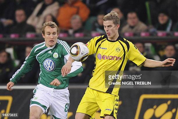 Wolfsburg's Danish midfielder Thomas Kahlenberg and Dortmund's midfielder Sven Bender vie for the ball during the German first division Bundesliga...
