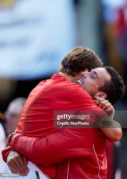 Roberto Bautista of Spain celebrates the victory with his teammate David Ferrer in his match against Philipp Kohlschreiber of Germany during day...
