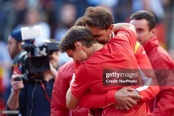 Rafael Nadal of Spain celebrates the victory of the match with his teammate David Ferrer in his match against Philipp Kohlschreiber of Germany during...