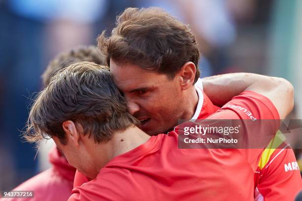 Rafael Nadal of Spain celebrates the victory of the match with his teammate David Ferrer in his match against Philipp Kohlschreiber of Germany during...