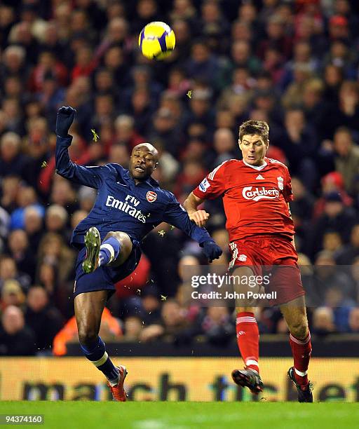 Steven Gerrard of Liverpool competes with William Gallas of Arsenal during the Barclays Premier League match between Liverpool and Arsenal at Anfield...