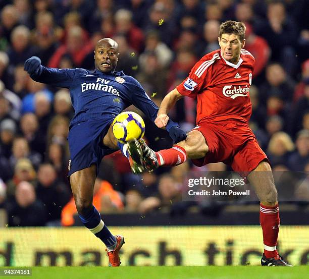 Steven Gerrard of Liverpool competes with William Gallas of Arsenal during the Barclays Premier League match between Liverpool and Arsenal at Anfield...