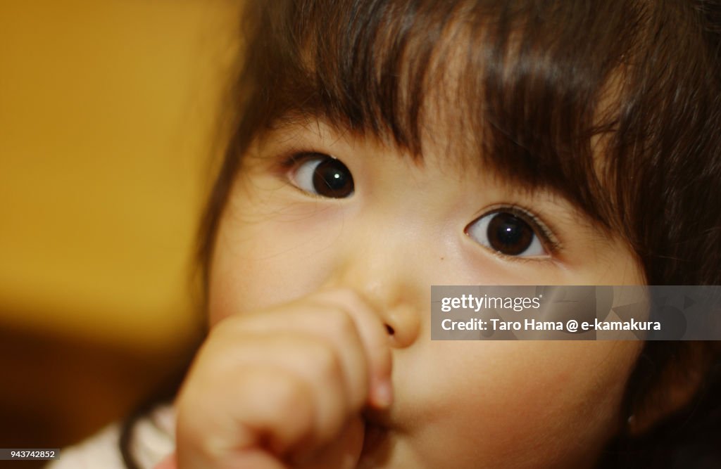 A girl relaxing in the living room at home in Japan