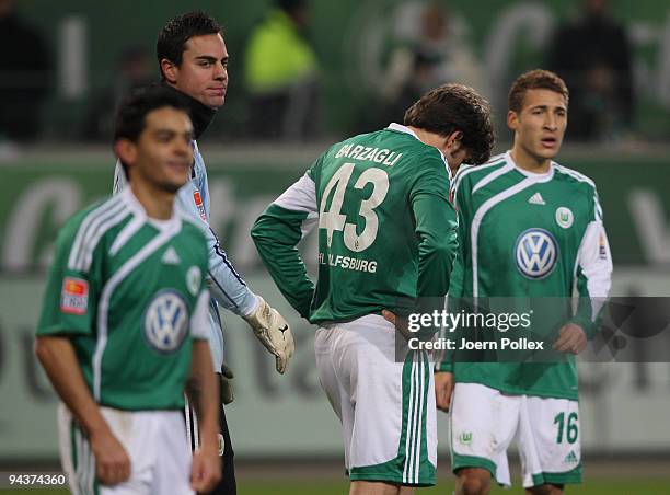 Josue, Diego Benaglio, Andrea Barzagli and Fabian Johnson of Wolfsburg look dejected during the Bundesliga match between VfL Wolfsburg and Borussia...