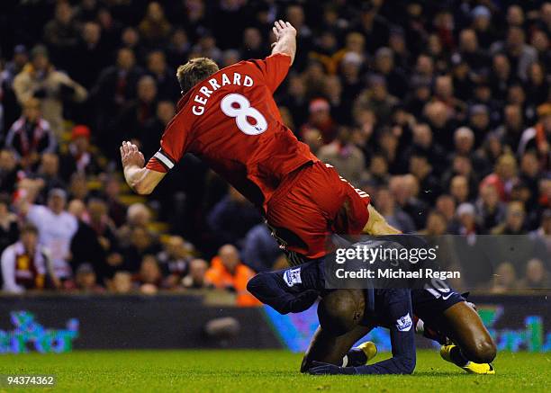 William Gallas of Arsenal tangles with Steven Gerrard of Liverpool in the penalty area during the Barclays Premier League match between Liverpool and...