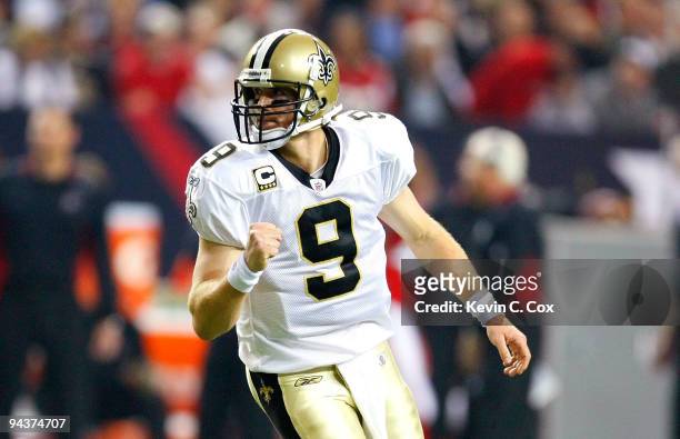 Quarterback Drew Brees of the New Orleans Saints celebrates after he threw a touchdown pass in the second quarter against the Atlanta Falcons at...