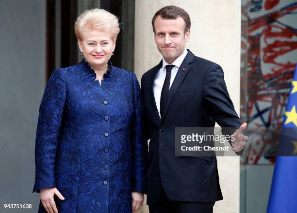 French President Emmanuel Macron welcomes Lituania President Dalia Grybauskaite prior to their meeting at the Elysee Presidential Palace on April 09,...