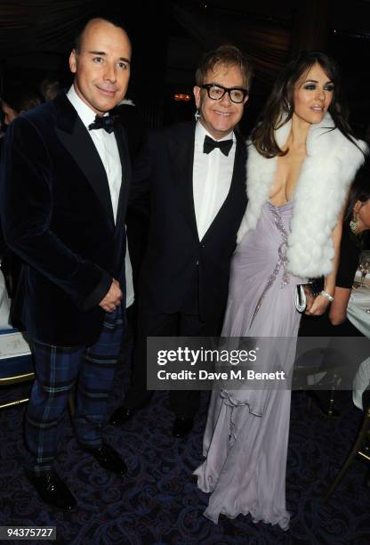 David Furnish, Sir Elton John and Elizabeth Hurley attend the Grey Goose Character & Cocktails Winter Fundraiser Ball in aid of the Elton John AIDS...