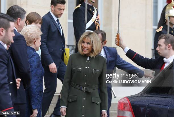 French President's wife Brigitte Macron speaks with Latvia President Raimonds Vejonis, Lituania President Dalia Grybauskaite and Estonia President...