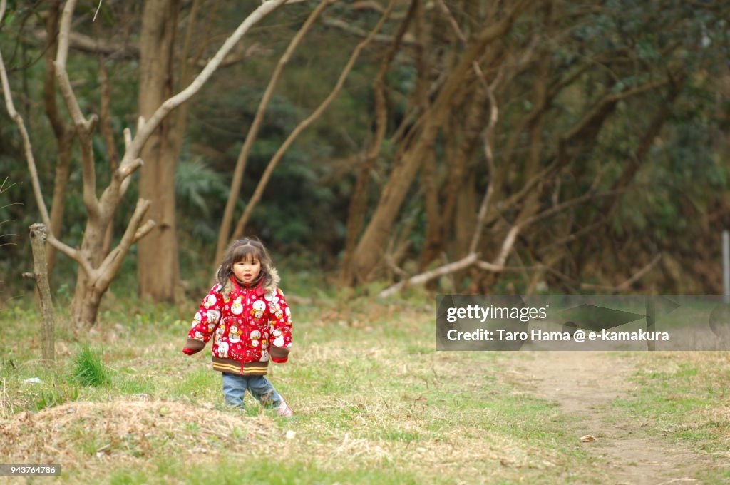 A girl standing in the park in Kamakura in Japan