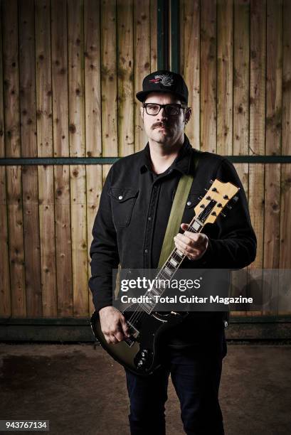 Portrait of American musician and producer Kurt Ballou, guitarist with heavy metal group Converge, photographed backstage at ArcTanGent Festival in...