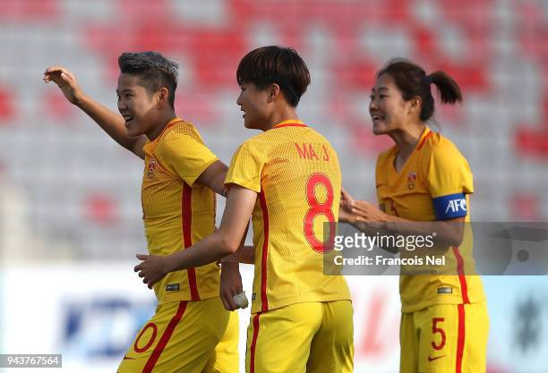 Li Ying of China celebrates scoring the opening goal with Ma Jun and Wu Haiyan during the AFC Women's Asian Cup Group A match between Philippines and...