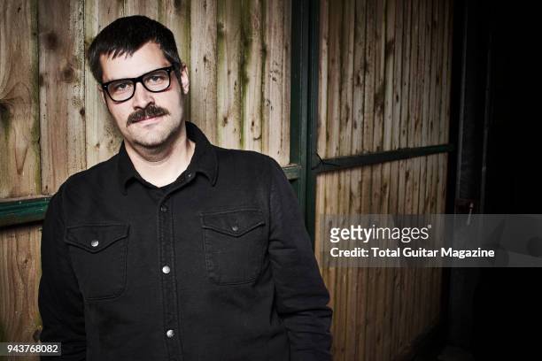 Portrait of American musician and producer Kurt Ballou, guitarist with heavy metal group Converge, photographed backstage at ArcTanGent Festival in...