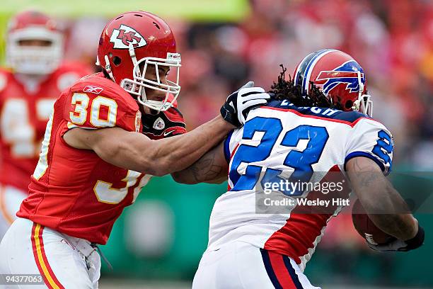 Safety Mike Brown of the Kansas City Chiefs tackles running back Marshawn Lynch of the Buffalo Bills at Arrowhead Stadium on December 13, 2009 Kansas...