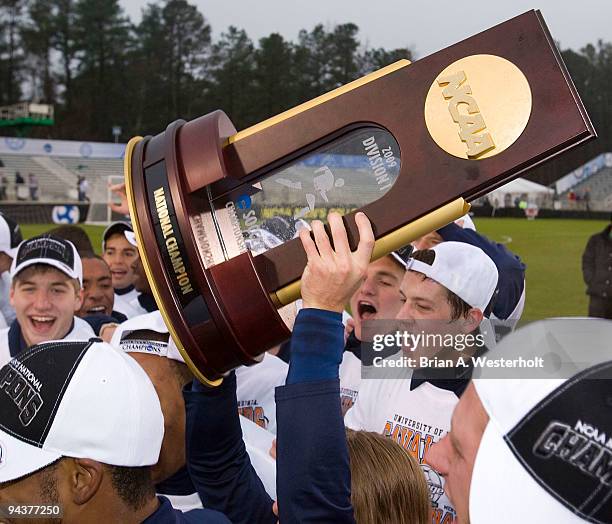 The Virginia Cavaliers hold the National Championship trophy after their win over the Akron Zips at the 2009 Men's College Cup final at WakeMed...