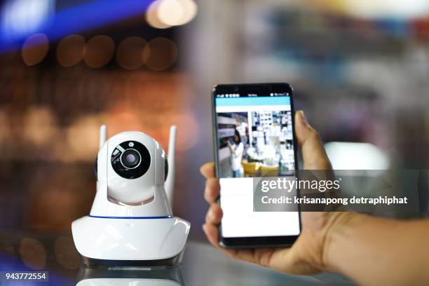 male hand press phone watch cctv - security camera view stock pictures, royalty-free photos & images