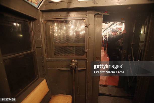 Worker rides an antique subway train during a "Vintage Tea Party" hosted by Levy's Unique New York tour group December 13, 2009 in New York City. New...