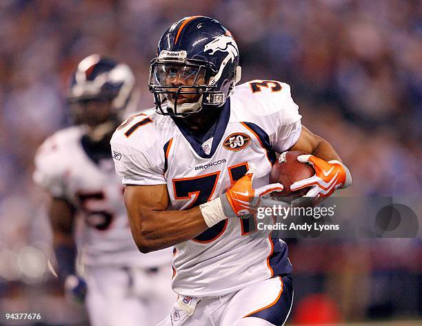 Darcel McBath of the Denver Broncos runs with the ball after intercepting a pass during the NFL game against the Indianapolis Colts at Lucas Oil...