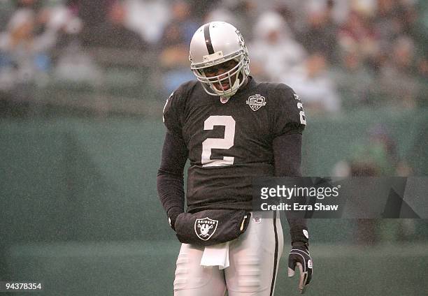 JaMarcus Russell of the Oakland Raiders walks off the field after calling a time out during their game against the Washington Redskins at...