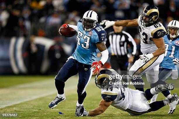 Keith Bulluck of the Tennessee Titans runs with the football after intercepting a pass against the St. Louis Rams at LP Field on December 13, 2009 in...