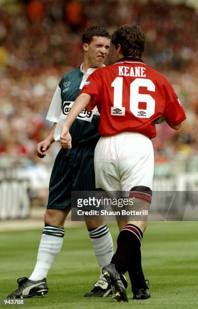 Robbie Fowler of Liverpool and Roy Keane of Manchester United exchange words during the FA Cup Final at Wembley Stadium in London. Manchester United...