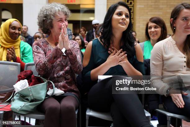 Palloma Jovita a senior at Framingham state, is humbled by a second round of applause after speaking during Immigrants Day at the Massachusetts State...