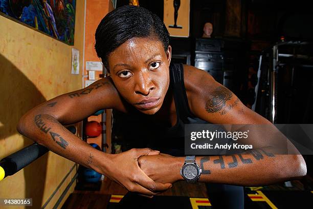 Suzanne "Africa" Engo wears a Hublot Geneva watch as she trains to run to raise awareness for AIDS In Africa at Sal Anthony's Movement Salon on...