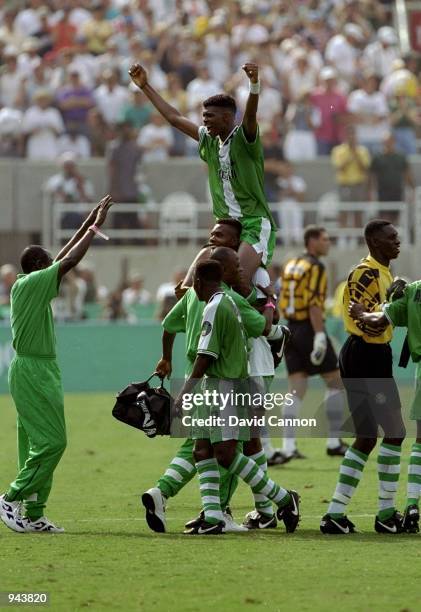 Nigeria Captain Nwankwo Kanu is carried by team mates after their victory in the Mens Football Final over Argentina at the Olympic Stadium during the...