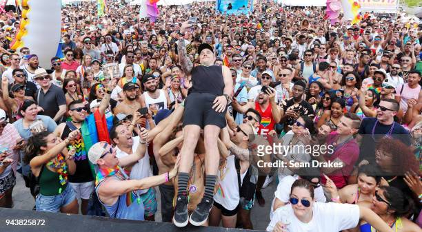 Olympian Gus Kenworthy crowd surfs during the 10th Annual Miami Beach Gay Pride celebration on South Beach on April 08, 2018 in Miami, Florida.