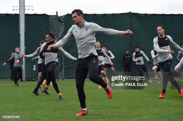 Liverpool's English defender Nathaniel Clyne , Liverpool's Croatian defender Dejan Lovren and Liverpool's Dutch defender Virgil van Dijk attend a...