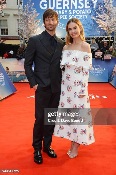Michiel Huisman and Lily James attend the World Premiere of "The Guernsey Literary And Potato Peel Pie Society" at The Curzon Mayfair on April 9,...