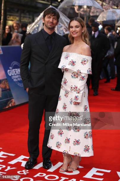 Michiel Huisman and Lily James attend 'The Guernsey Literary And Potato Peel Pie Society' World Premiere at The Curzon Mayfair on April 9, 2018 in...