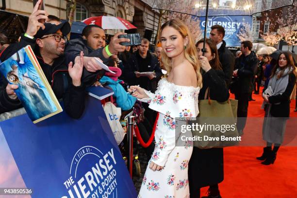 Lily James attends the World Premiere of "The Guernsey Literary And Potato Peel Pie Society" at The Curzon Mayfair on April 9, 2018 in London,...