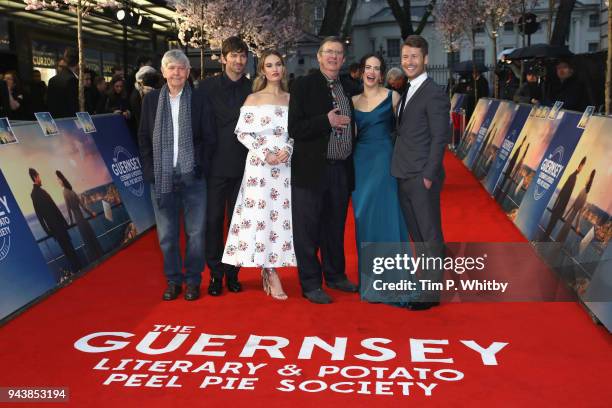 Tom Courtenay, Michael Hulsman, Lily James, Mike Newell, Jessica Brown Findlay and Glen Powell attend 'The Guernsey Literary And Potato Peel Pie...