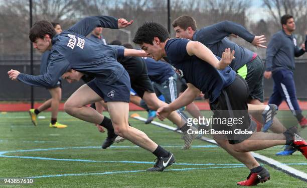Players run sprints at a rugby practice session at Belmont High School in Belmont, MA on April 2, 2018. When Greg Bruce first began working as a...