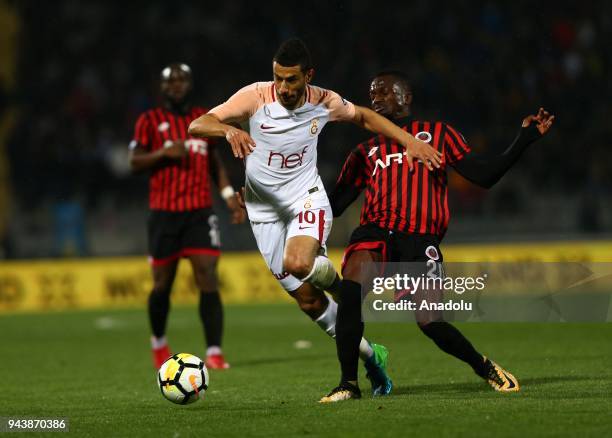 Belhanda of Galatasaray in action against Issah of Genclerbirligi during Turkish Super Lig soccer match between Genclerbirligi and Galatasaray at...