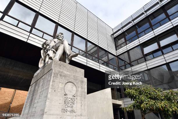 The statue of German physicist and mathematician Georg Simon Ohm at an entrance of the Main Campus of the Technical University of Munich on April 9,...