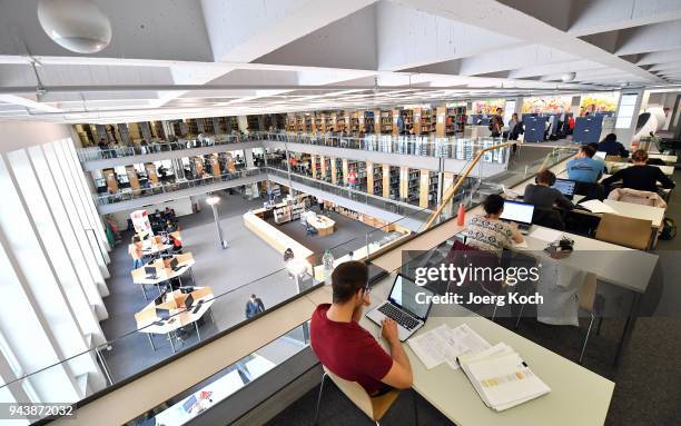 Students sit at study tables in the Branch Library Main Campus faculty at the Technical University of Munich on April 9, 2018 in Munich, Germany. The...