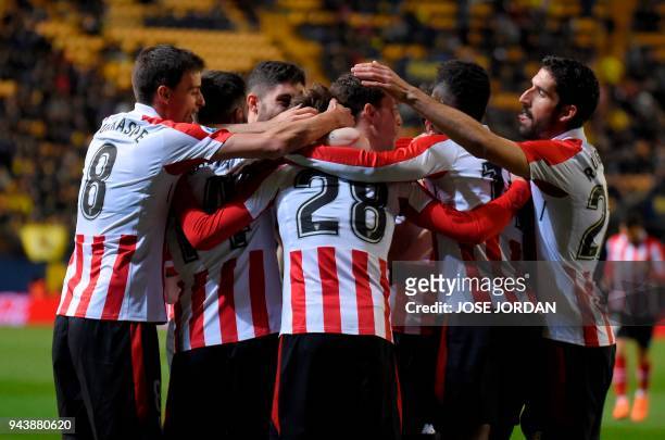 Athletic Bilbao's Spanish midfielder Inigo Cordoba celebrates with teammates after scoring during the Spanish league football match between...
