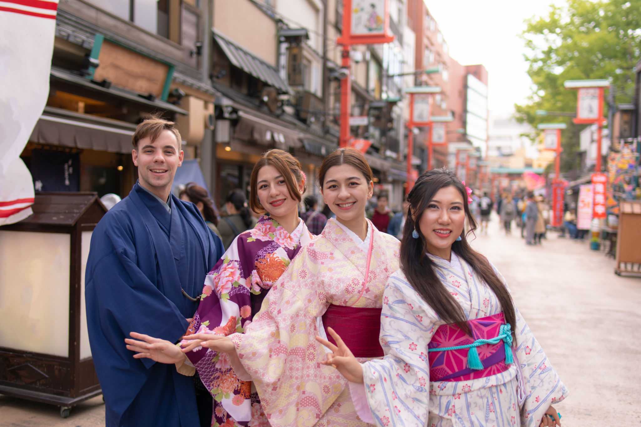 Multi-Ethnic group of people in kimono standing in traditional Japanese town Multi-Ethnic group of people in kimono standing in traditional Japanese town