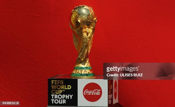 The FIFA World Cup trophy is displayed upon arrival at Miguel Hidalgo International Airport in Guadalajara, Jalisco State, Mexico, on April 9, 2018...