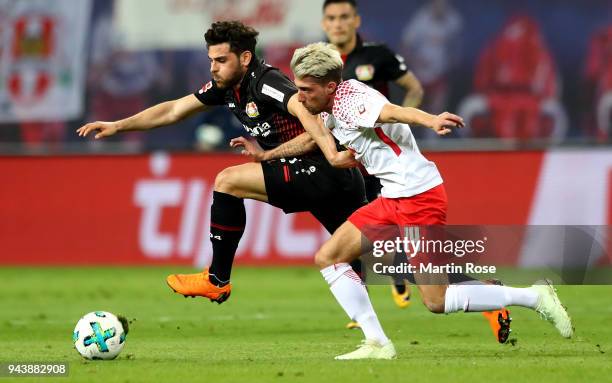 Kevin Kampl of Leipzig and Kevin Volland of Leverkusen battle for the ball during the Bundesliga match between RB Leipzig and Bayer 04 Leverkusen at...