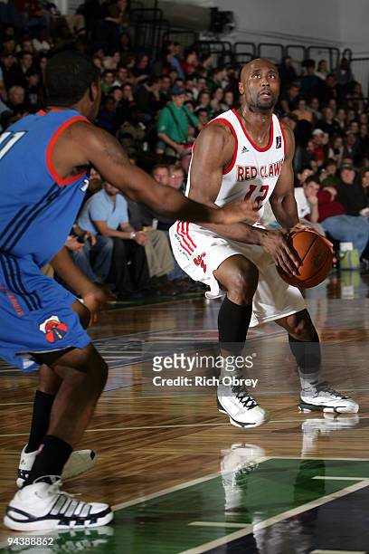 Billy Thomas of the Maine Red Claws steps away from his defender Cecil Brown of the Tulsa 66ers to score two points during the game on December 13,...