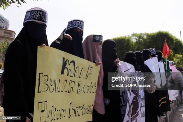 Females protesters seen at the demonstration. Hundreds of Muslims from the Islamic Defenders Front Aceh protest Sukmawati Soekarnoputri who has...