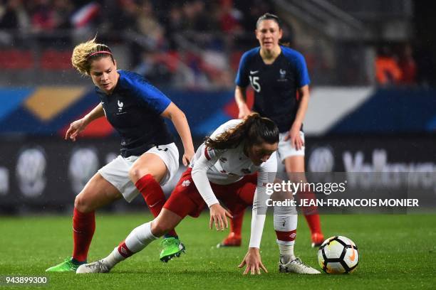 France's forward Eugenie Le Sommer vies for the ball with Canada's midfielder Jessie Fleming during the women's friendly football match between...