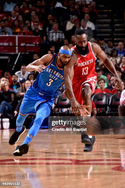 Isaiah Canaan of the Oklahoma City Thunder and James Harden of the Houston Rockets fight for possession of the ball on April 7, 2018 at the Toyota...