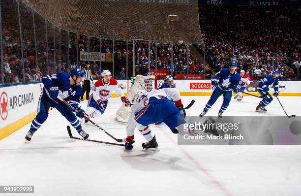 Morgan Rielly of the Toronto Maple Leafs passes the puck off against the Montreal Canadiens during the second period at the Air Canada Centre on...