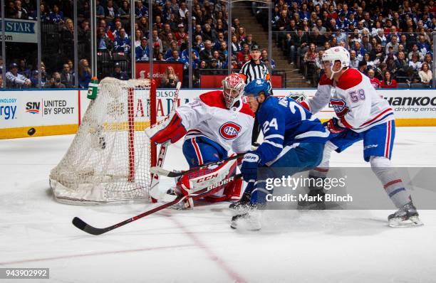 Kasperi Kapanen of the Toronto Maple Leafs skates against Noah Juulsen and Carey Price of the Montreal Canadiens during the third period at the Air...
