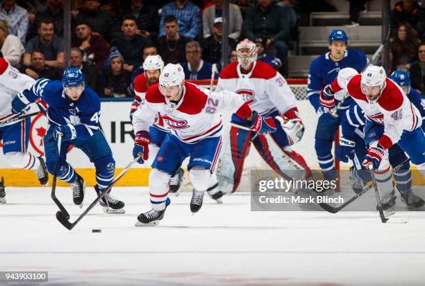 Artturi Lehkonen of the Montreal Canadiens carries the puck with teammate Logan Shaw against Tyler Bozak of the Toronto Maple Leafs during the second...