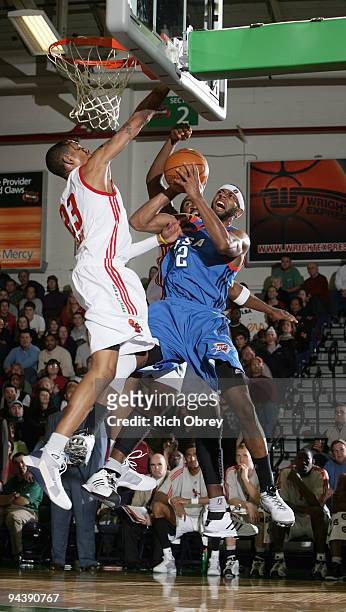 Trey Gilder and Darnell Lazare of the Maine Red Claws shut down Mustafa Shakur of the Tulsa 66ers on a drive during the game on December 13, 2009 at...